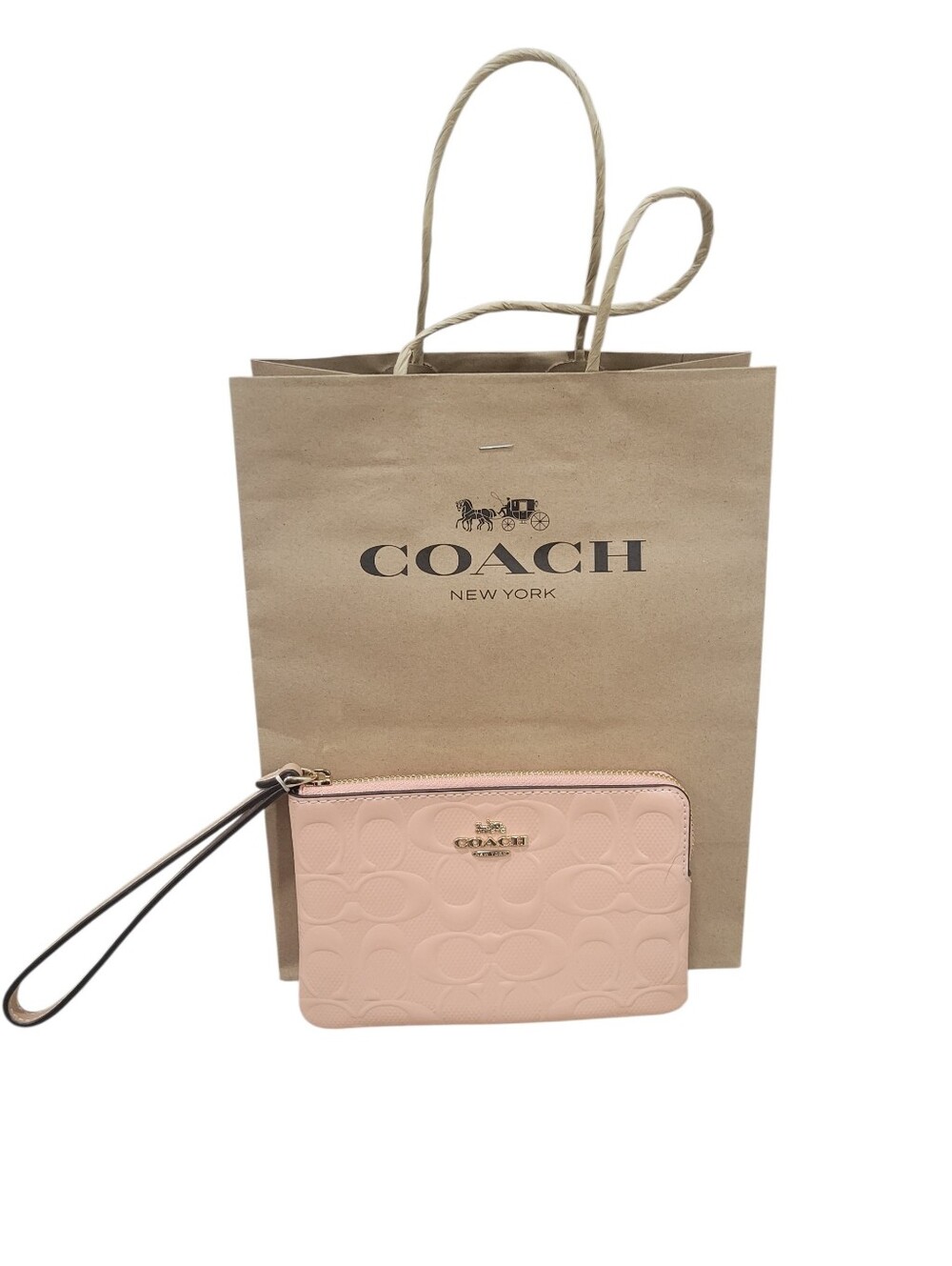 COACH Corner Zip Wristlet In Signature Debossed Patent Leather Pale Pink / Peach